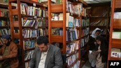 People read books inside the Darra Adam Khel Library in Darra Adamkhel town, 35 kilometers south of Peshawar, Pakistan, Dec. 14, 2022.