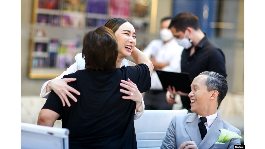 FILE - Anne Jakkaphong Jakrajutatip greets her staff before an interview with Reuters in Bangkok, Oct. 27, 2022.