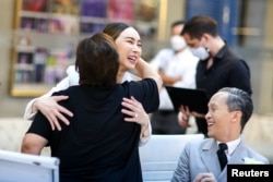 FILE - Anne Jakkaphong Jakrajutatip greets her staff before an interview with Reuters in Bangkok, Oct. 27, 2022.