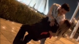 This image grab taken from a UGC video posted on Twitter on Jan. 29, 2023, shows Astiyazh Haghighi and her fiance Amir Mohammad Ahmadi dancing in front of Tehran's Azadi Tower.