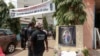 FILE - Mourners gather in the courtyard of Radio Amplitude FM, during a tribute ceremony for journalist Martinez Zogo, in the Elig Essono district of Yaounde, Cameroon, on Jan. 23, 2023.
