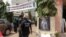FILE - Mourners gather in the courtyard of Radio Amplitude FM, during a tribute ceremony for journalist Martinez Zogo, inYaounde on January 23, 2023. - A popular Cameroon radio journalist who had been missing following an alleged abduction has been found dead.