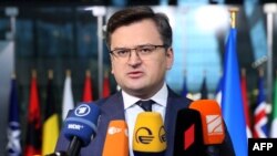 Ukraine's Foreign Minister Dmytro Kuleba speaks to the press before a meeting of NATO foreign ministers at NATO headquarters, in Brussels, on April 7, 2022.