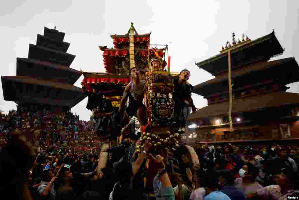 The chariot of God Bhairab is pulled through the city center during the Biska festival in Bhaktapur, Nepal.