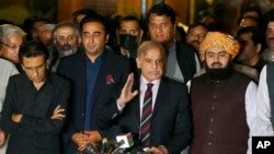 Pakistan opposition leader Shahbaz Sharif, center, speaks at a press conference in Islamabad, Pakistan, April 7, 2022.