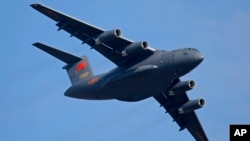 FILE - A Y-20 Chinese military transport plane is seen during an airshow in Zhuhai city, China, Nov. 7, 2018. Media and military experts said Sunday that six Chinese Y-20 planes landed in Belgrade Saturday, reportedly carrying surface-to-air missiles for the Serbian military.