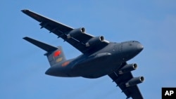 FILE - A Y-20 Chinese military transport plane during an airshow in China, Nov. 7, 2018. China has increased the number of military flights into Taiwan’s air defense identification zone at sea. Analysts believe the move is designed to send a message to the U.S. 