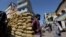 A man stands by a cart with potatoes at a market, amid the country's economic crisis in Colombo, Sri Lanka, April 7, 2022.