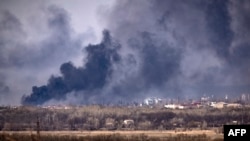 Smoke rises over the city of Rubizhne, Luhansk region, eastern Ukraine, April 7, 2022, amid Russia's invasion of its neighbor.