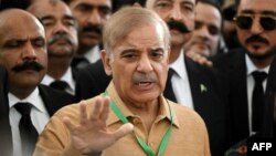 FILE: Pakistan opposition leader Shehbaz Sharif speaks with the media before attending a hearing outside the Supreme Court building in Islamabad, April 7, 2022.