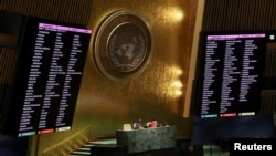 FILE - Displays show the list of countries taking part a vote on suspending Russia from the U.N. Human Rights Council during an emergency special session of the U.N. General Assembly on Russia's invasion of Ukraine, at the U.N. headquarters in New York City, April 7, 2022.