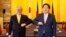 Japan's Foreign Minister Yoshimasa Hayashi, right, and Philippine Foreign Secretary Teodoro Locsin pose before a meeting at the Iikura Guest House in Tokyo on April 9, 2022.