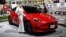 Seorang model mempromosikan mobil listrik Tesla Model Y di Bangkok International Motor Show di Bangkok pada 24 Maret 2022. (Foto: AFP/Lillian SUWANRUMPHA)