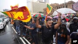 Sri Lankans demanding President Gotabaya Rajapaksa resign over the debt-ridden country’s worst economic crisis protest outside the president's office in Colombo, April 10, 2022.