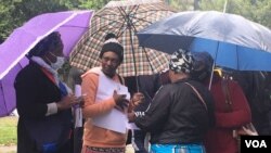 Some of the relatives and friends of the late Elvis Nyathi who held a meeting in Hillbrow, South Africa, to prepare for his burial.