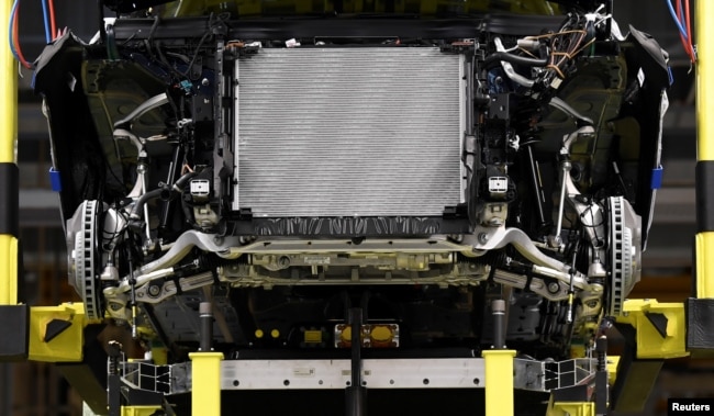 In this file photo, a battery cell is shown being installed at a Mercedes-Benz EQC electric car in a production line at a plant in Bremen, Germany, January 29, 2020. (REUTERS/Fabian Bimmer)