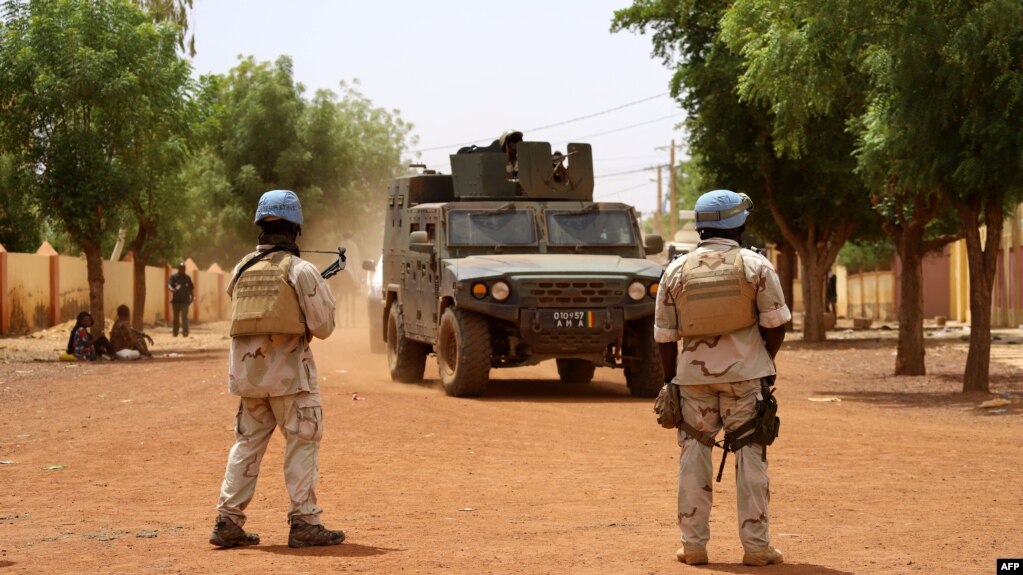 FILE - Soldiers of the U.N. peacekeeping mission in Mali, MINUSMA, patrol in the streets of Gao, Mali, July 24, 2019. Three peacekeepers were killed and three injured when their vehicle hit a bomb in Mali on Oct. 17, 2022.