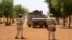 FILE - Soldiers of the U.N. peacekeeping mission in Mali MINUSMA patrol in the streets of Gao, Mali, July 24, 2019.