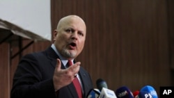 FILE - Karim Ahmed Khan, International Criminal Court chief prosecutor, speaks during a news conference at the Ministry of Justice in Khartoum, Sudan, Aug. 12, 2021. Khan said on April 5, 2022, that alleged militia leader Ali Kushayb, now on trial at The Hague, took a “strange glee” in his ruthless reputation during the Darfur conflict.