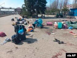 In this photo published on Ukrainian President Volodymyr Zelenskyy's Telegram channel, blood stains are seen among bags and a baby carriage on a platform after a missile struck a railway station in Kramatorsk, Ukraine, April 8, 2022.