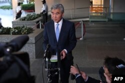 FILE - U.S. Special Representative for North Korea Policy Sung Kim speaks to reporters outside the State Department in Washington, Oct. 18, 2021.