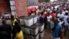 People wait to vote during the presidential election at a polling station in Monrovia, Liberia, Oct. 10, 2017. 