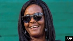 (FILE) This file photo taken on August 25, 2017 shows Zimbabwe's first lady Grace Mugabe attending the opening of the annual agricultural fair in the capital Harare. Zimbabwe's leading university has published the thesis submitted by former first lady Grace Mugabe, who was controversially awarded a doctorate which is now the subject of a fraud investigation. AFP PHOTO / Jekesai NJIKIZANA