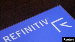 FILE - The Refinitiv logo is seen on a screen in offices in Canary Wharf in London, Aug. 1, 2019.