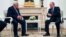 Russian President Vladimir Putin, right, speaks to Palestinian President Mahmoud Abbas, during their meeting in the Kremlin in Moscow, Feb. 12, 2018.