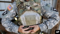 Body armor was among the items stolen at Fort Campbell, Kentucky. Six soldiers and two civilians were indicted on charges of stealing and selling military equipment to foreign buyers.