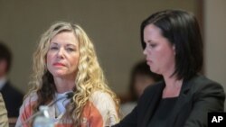 FILE - Lori Vallow Daybell glances at the camera during her hearing on March 6, 2020, in Rexburg, Idaho. At her right is defense attorney Edwina Elcox.