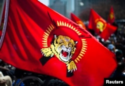 FILE - A Tamil Tigers flag is seen as Tamils demonstrate on a downtown street to protest the political turmoil in Sri Lanka, in Toronto, April 27, 2009.