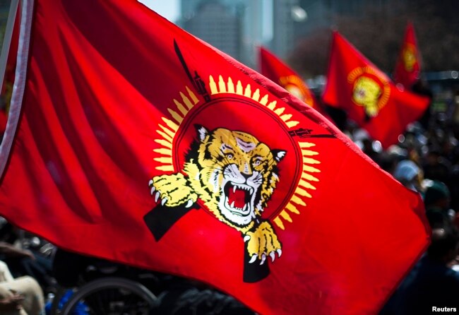 FILE - A Tamil Tigers flag is seen as Tamils demonstrate on a downtown street to protest the political turmoil in Sri Lanka, in Toronto, April 27, 2009.