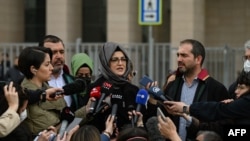 Hatice Cengiz, the fiancee of slain Saudi critic Jamal Khashoggi, answers journalists' questions outside the courthouse in Istanbul, April 7, 2022. 