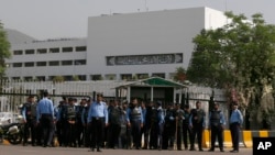 Police officers stand guard to ensure security outside the National Assembly, in Islamabad, Pakistan, April 9, 2022.