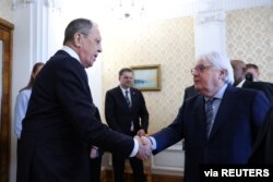 Russia's Foreign Minister Sergey Lavrov shakes hands with United Nations humanitarian chief Martin Griffiths during a meeting in Moscow, Russia, April 4, 2022. (Russian Foreign Ministry/Handout via Reuters)