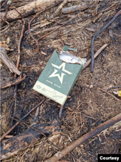 Discarded green packets that resemble Russian military food rations are seen around trenches recently dug into radioactive soil near the Chernobyl nuclear power plant, damaged in a 1986 disaster. April 5, 2022. (Courtesy Evgen Kramarenko)