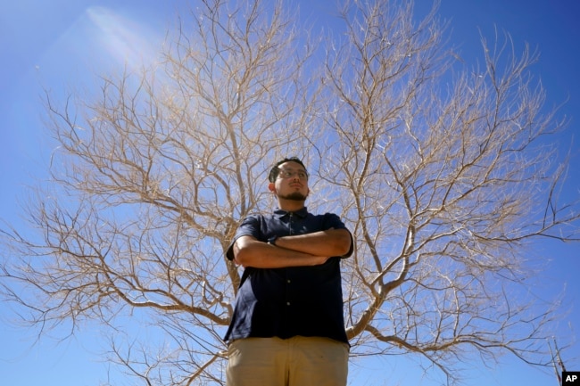 Benito Luna-Herrera, a 7th-grade social studies teacher at California City Middle School, poses for a photo, March 11, 2022. (AP Photo/Damian Dovarganes)