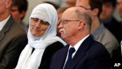 FILE - Ed and Paula Kassig, parents of Peter Kassig, reflect as a funeral prayers were held for their son in the mosque at Al-Huda Foundation in Fishers, Ind., Nov. 21, 2014.