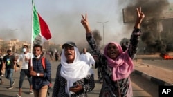 Sudanese protesters take part in a rally against military rule on the anniversary of previous popular uprisings, in Khartoum, Sudan, April 6, 2022.