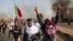 Sudanese protesters take part in a rally against military rule on the anniversary of previous popular uprisings, in Khartoum, Sudan, April 6, 2022.