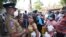 Sri Lankans wait at a fuel station after spending hours in line to buy kerosene oil in Colombo, Sri Lanka, April 7, 2022. 