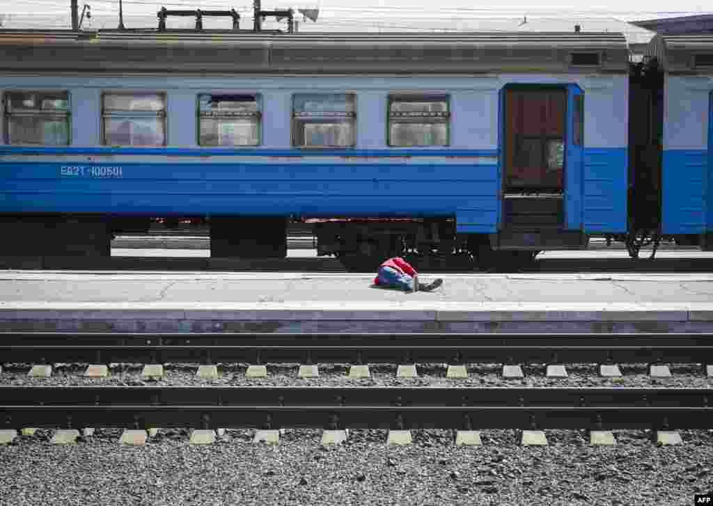 A casualty lies on the platform in the aftermath of a rocket attack on the railway station in the eastern city of Kramatorsk, in the Donbas region, in eastern Ukraine. More than 30 people were killed and over 100 injured.