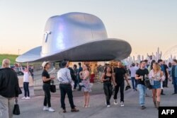 A giant cowboy hat is on display outside the Tesla Giga Texas manufacturing facility during the 'Cyber Rodeo' grand opening party on April 7, 2022 in Austin, Texas.