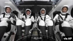 This photo provided by SpaceX shows the SpaceX crew seated in the Dragon spacecraft in Cape Canaveral, Florida, April 8, 2022.
