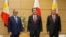 Philippine Foreign Secretary Teodoro Locsin, left, and Defense Secretary Delfin Lorenzana meet Japanese Prime Minister Fumio Kishida, center, at the official residence in Tokyo, Friday, April 8, 2022. (Kimimasa Mayama, Pool via AP)