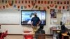 Benito Luna-Herrera, a 7th-grade social studies teacher, presents a mental health video, March 11, 2022. (AP Photo/Damian Dovarganes)