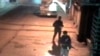 Closed circuit television footage shows gunmen walking across parking lot after shooting spree at Chhatrapati...