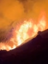 This image from video provided by the U.S. Geological Survey shows a lava lake erupting on the west caldera wall of the Kilauea volcano in Hawaii, on Dec. 23, 2024.