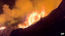 This image from video provided by the U.S. Geological Survey shows a lava lake erupting on the west caldera wall of the Kilauea volcano in Hawaii, on Dec. 23, 2024.